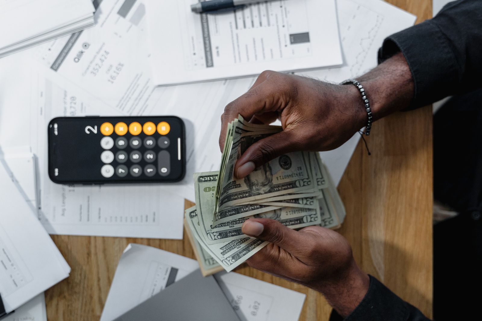 Payroll paperwork and calculations on a desk